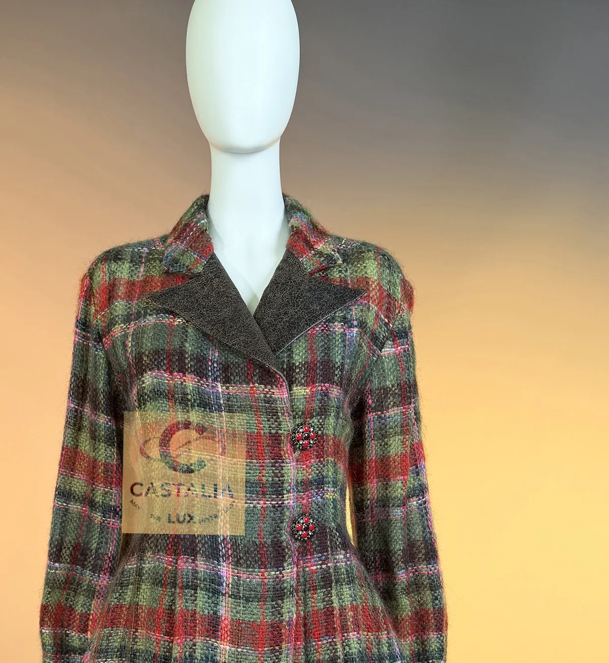 The Paris–Édimbourg Highland jacket: a check of moss green, crimson and rose, leather lapels, jewelled buttons